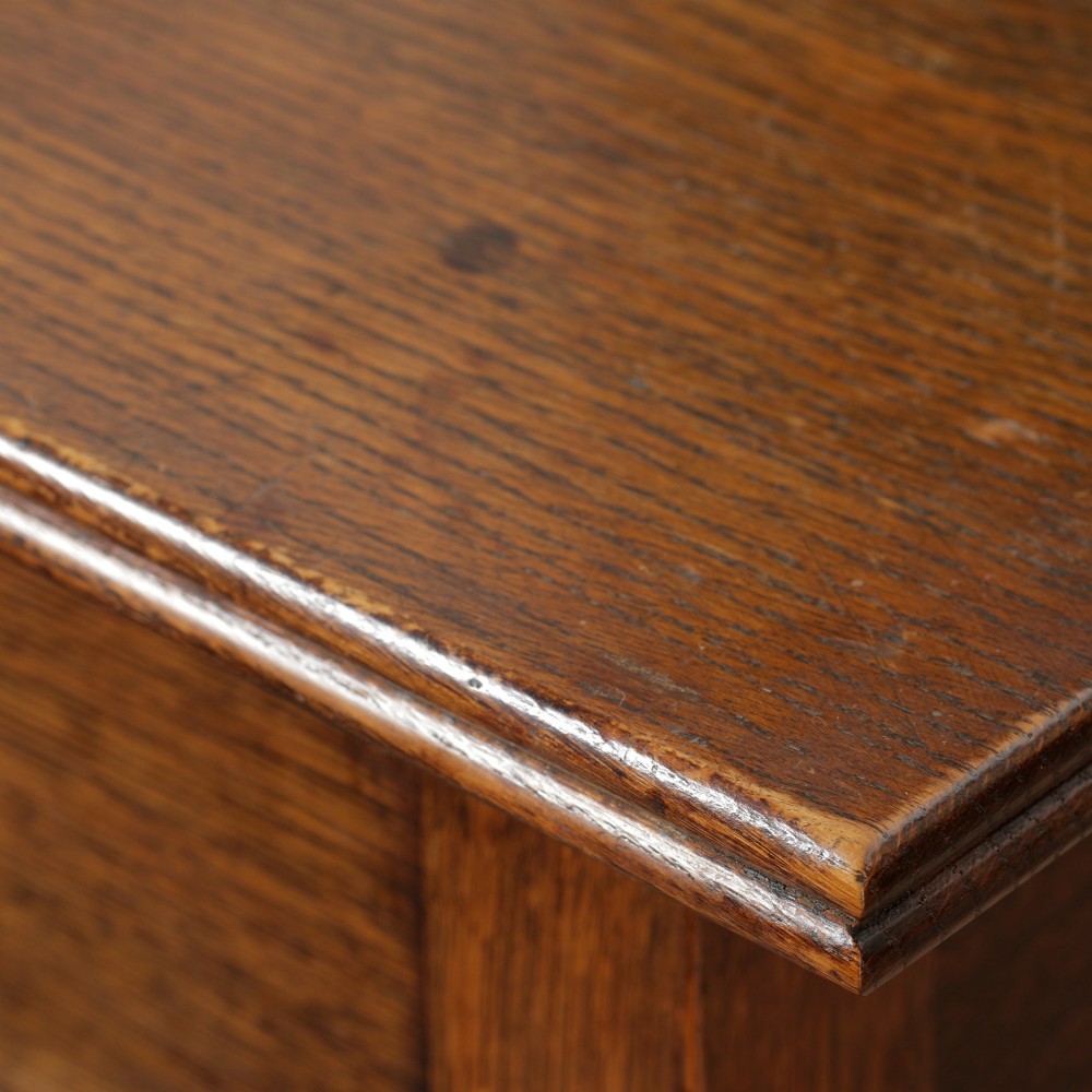 A George III Georgian oak side table featuring a single drawer with a brass handle plate and four square tapered legs. View VIII