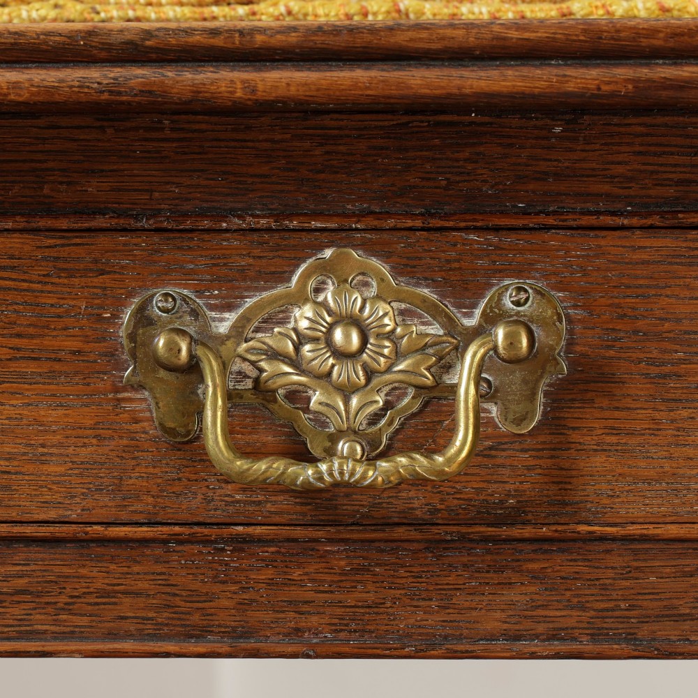 A George III Georgian oak side table featuring a single drawer with a brass handle plate and four square tapered legs. View IX