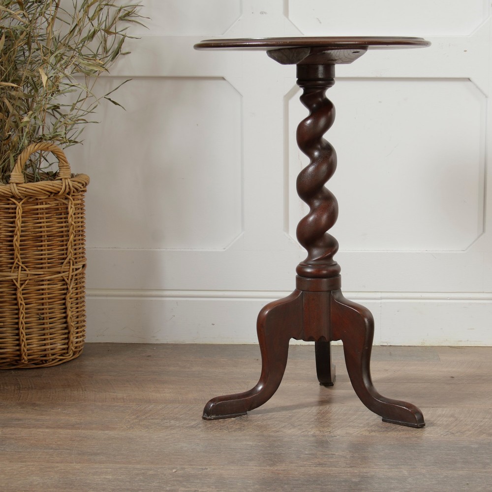 A Victorian dark walnut pedestal table featuring a circular top, a central barley twist turned column, and a tripod base. View II