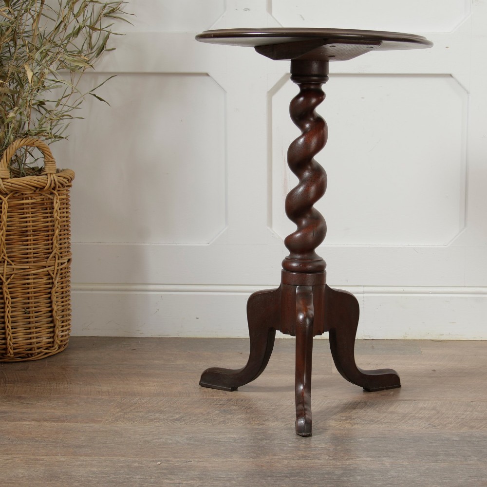 A Victorian dark walnut pedestal table featuring a circular top, a central barley twist turned column, and a tripod base. View III
