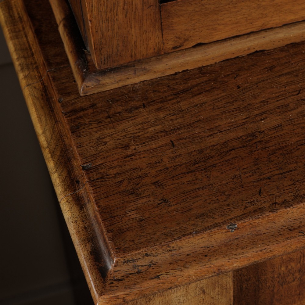 A mid-Victorian mahogany bookcase featuring a two-door glazed upper section, a single frieze drawer, and a lower cupboard with carved panel doors. View XIII