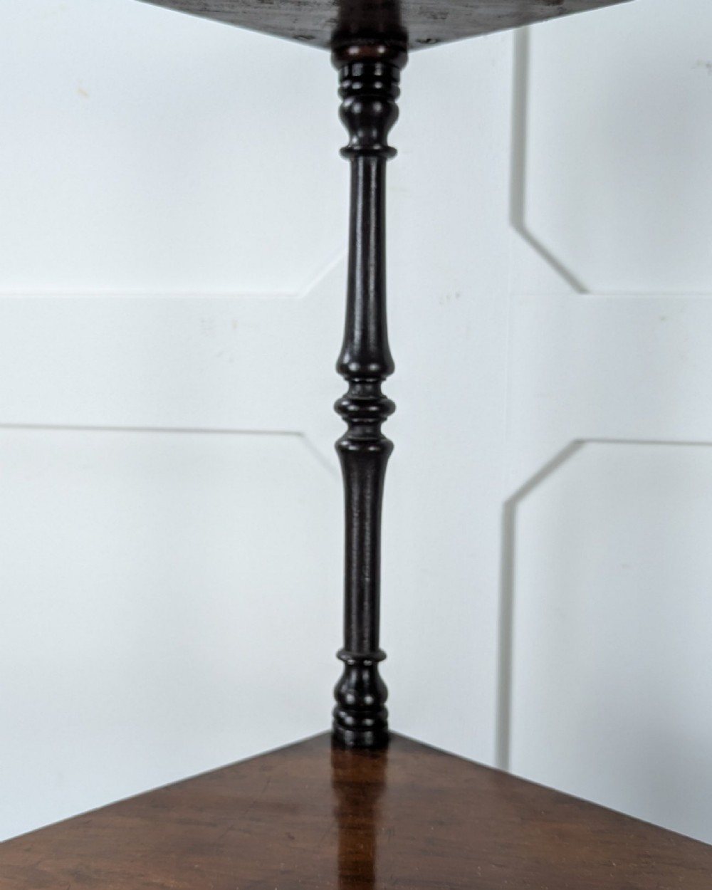 A Victorian dark mahogany three-tier corner whatnot featuring spiralled barley twist front supports and finial details. View IX