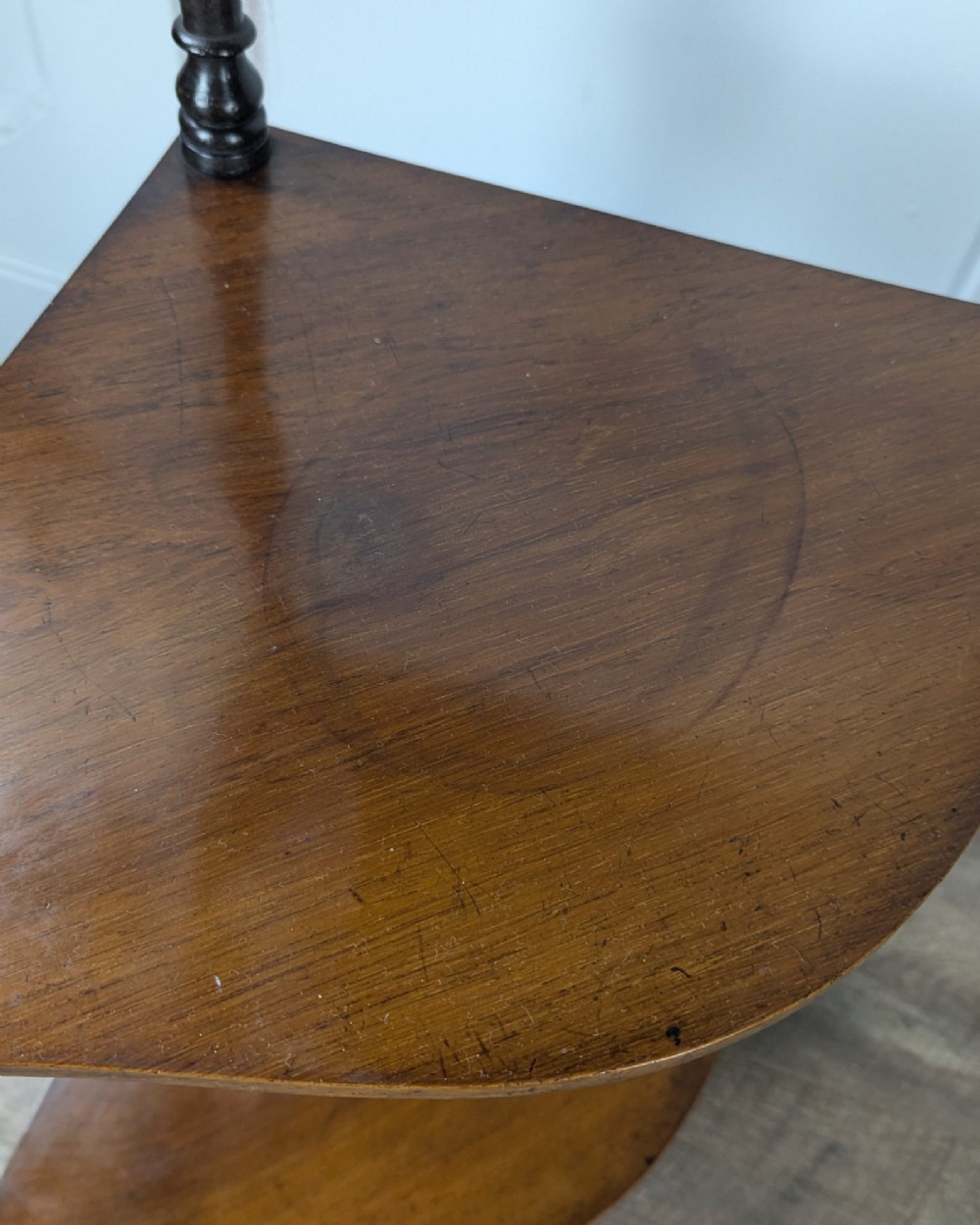 A Victorian dark mahogany three-tier corner whatnot featuring spiralled barley twist front supports and finial details. View X