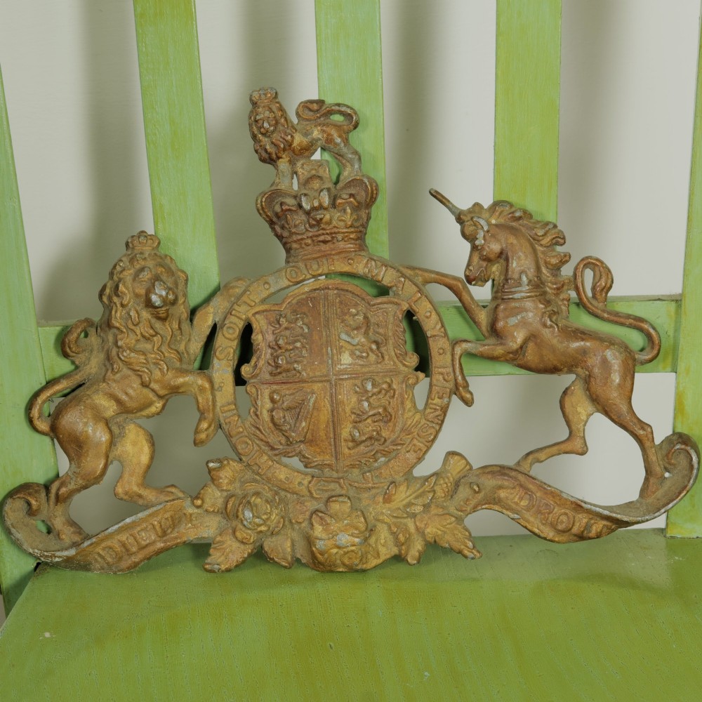 A Victorian cast metal relief plaque depicting the Royal Coat of Arms of the United Kingdom flanked by a lion and unicorn. View IX