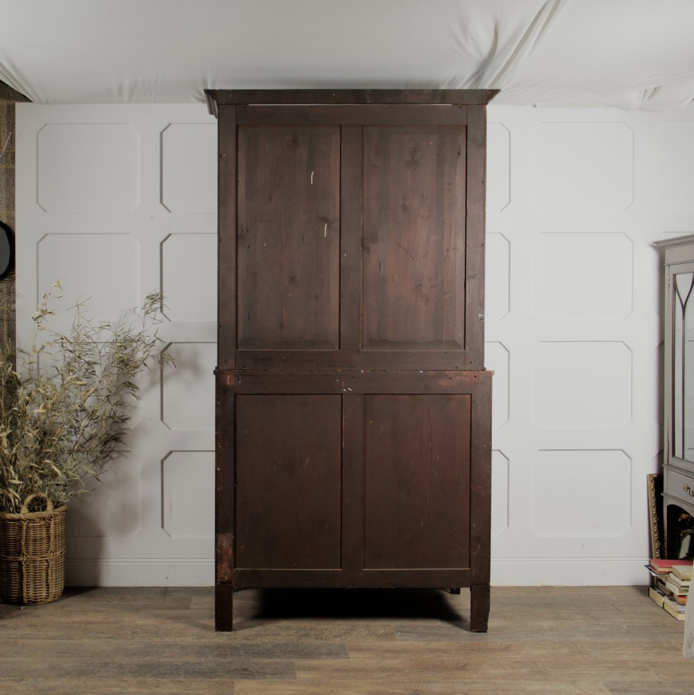 A 19th-century mahogany secretaire bookcase featuring an upper glazed cabinet with gothic arch doors and a lower chest of drawers. View V