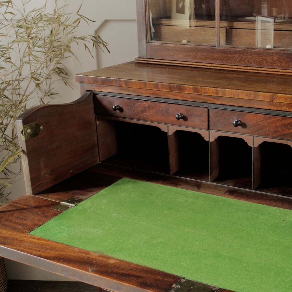 A 19th-century mahogany secretaire bookcase featuring an upper glazed cabinet with gothic arch doors and a lower chest of drawers. View VII
