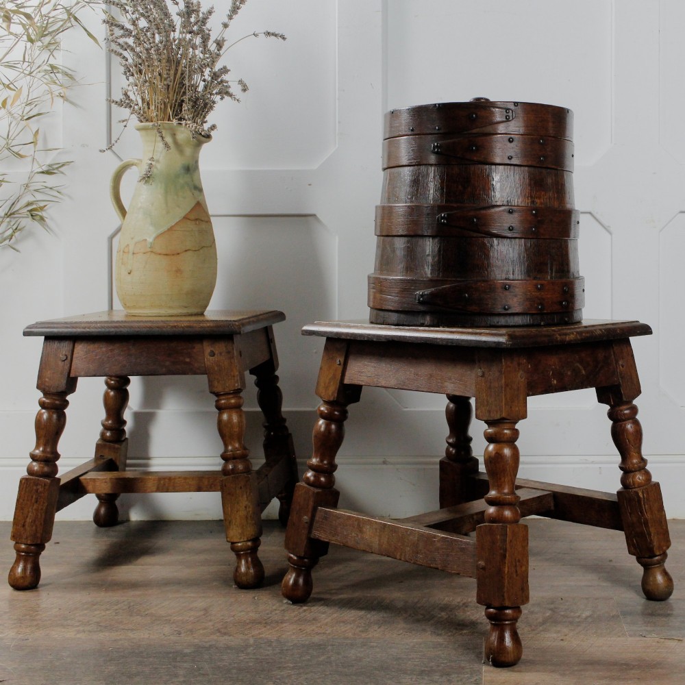 A pair of 19th-century oak joint stools featuring square tops, turned baluster legs, pegged joinery, and low perimeter stretchers. View II