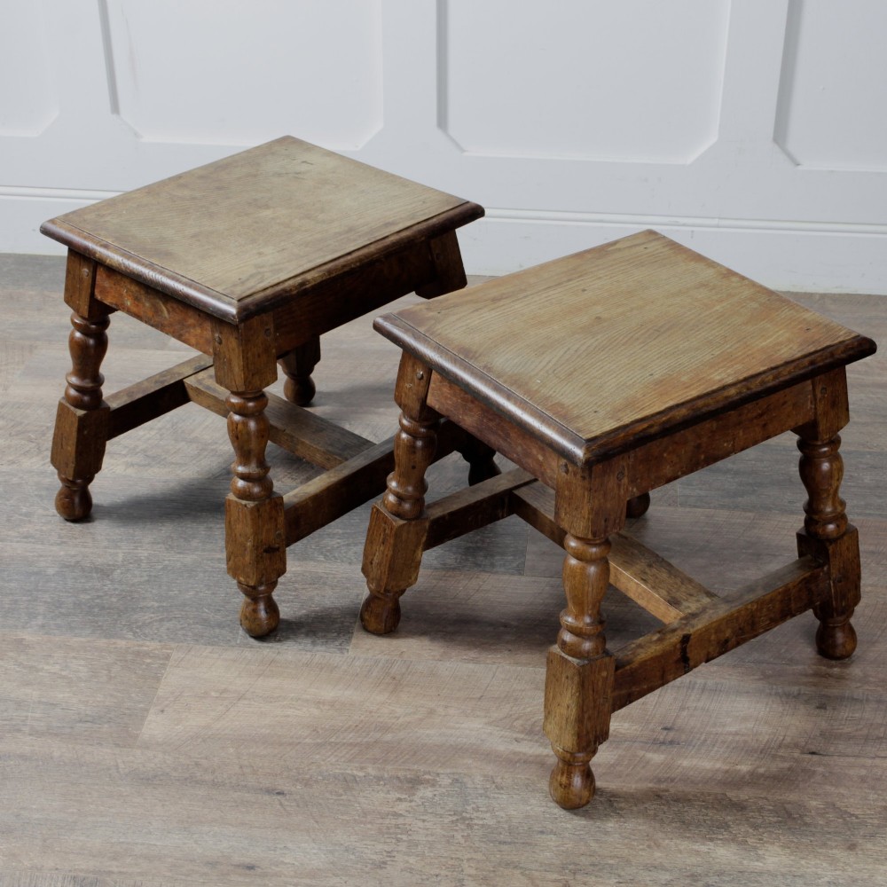 A pair of 19th-century oak joint stools featuring square tops, turned baluster legs, pegged joinery, and low perimeter stretchers. View III