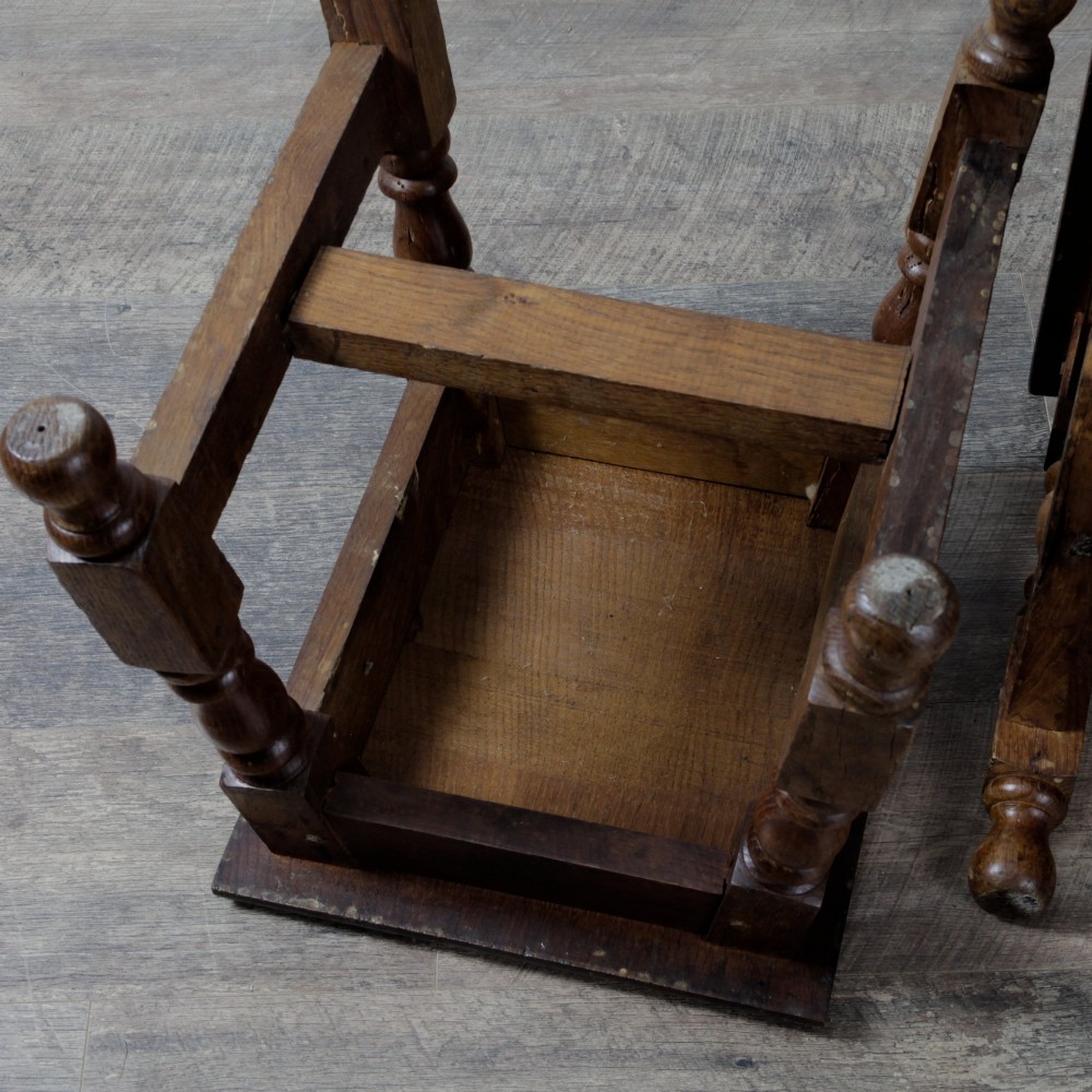 A pair of 19th-century oak joint stools featuring square tops, turned baluster legs, pegged joinery, and low perimeter stretchers. View VIII