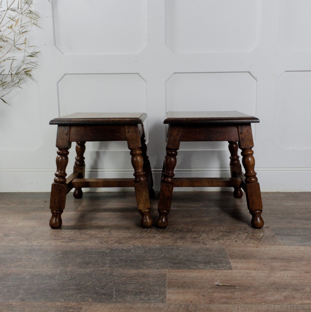 A pair of 19th-century oak joint stools featuring square tops, turned baluster legs, pegged joinery, and low perimeter stretchers. View XI