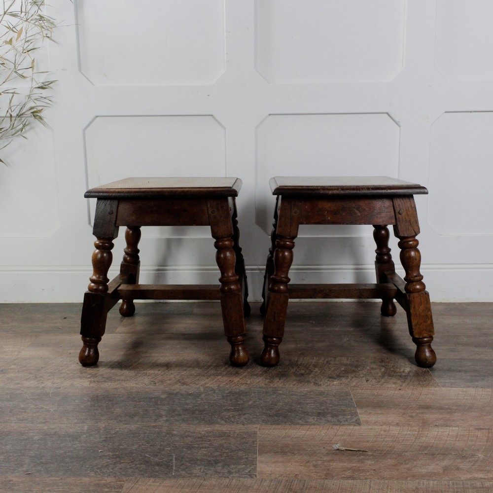 A pair of 19th-century oak joint stools featuring square tops, turned baluster legs, pegged joinery, and low perimeter stretchers. View XII