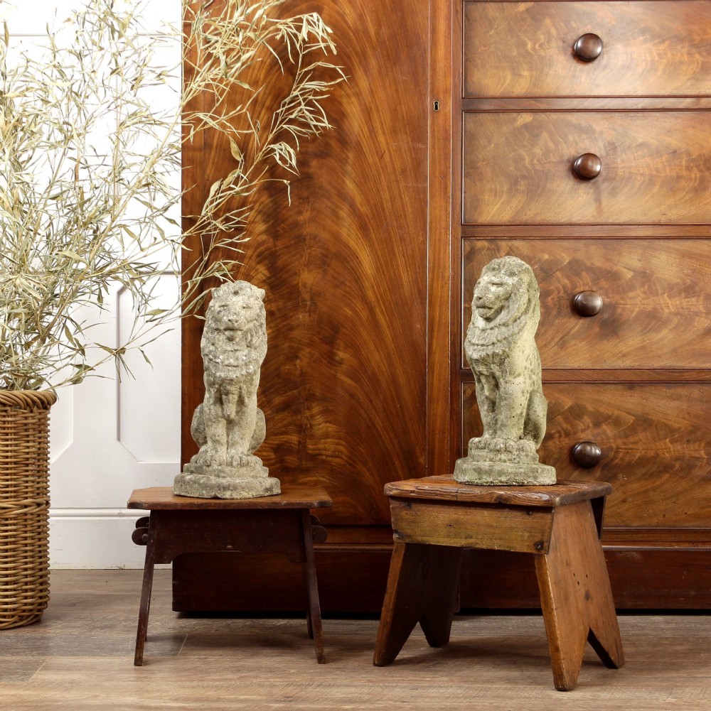 A pair of small 19th-century wooden country stools constructed from dark oak and pine with cut-out trestle legs. View II