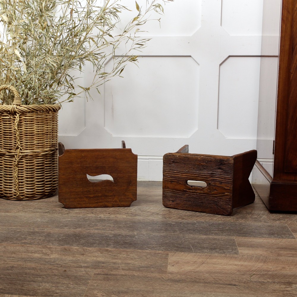 A pair of small 19th-century wooden country stools constructed from dark oak and pine with cut-out trestle legs. View VIII