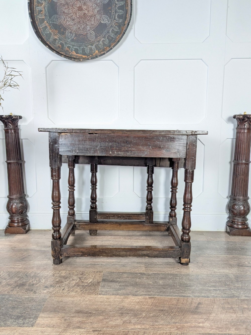 An eighteenth-century dark oak gateleg table with drop leaves, turned legs, stretchers, and a single end drawer. View VIII