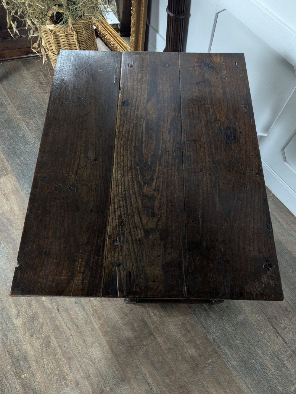 An eighteenth-century dark oak gateleg table with drop leaves, turned legs, stretchers, and a single end drawer. View XV