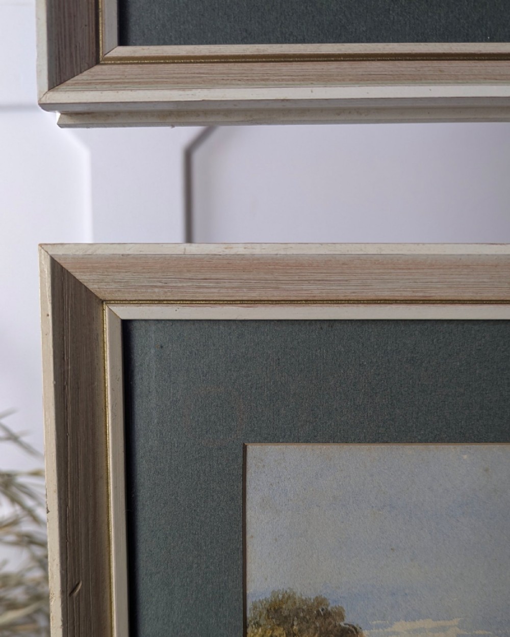 Pair of 1879 Victorian watercolour paintings depicting rural English cottage landscapes, presented in dark green mounts and light wood frames. View VIII
