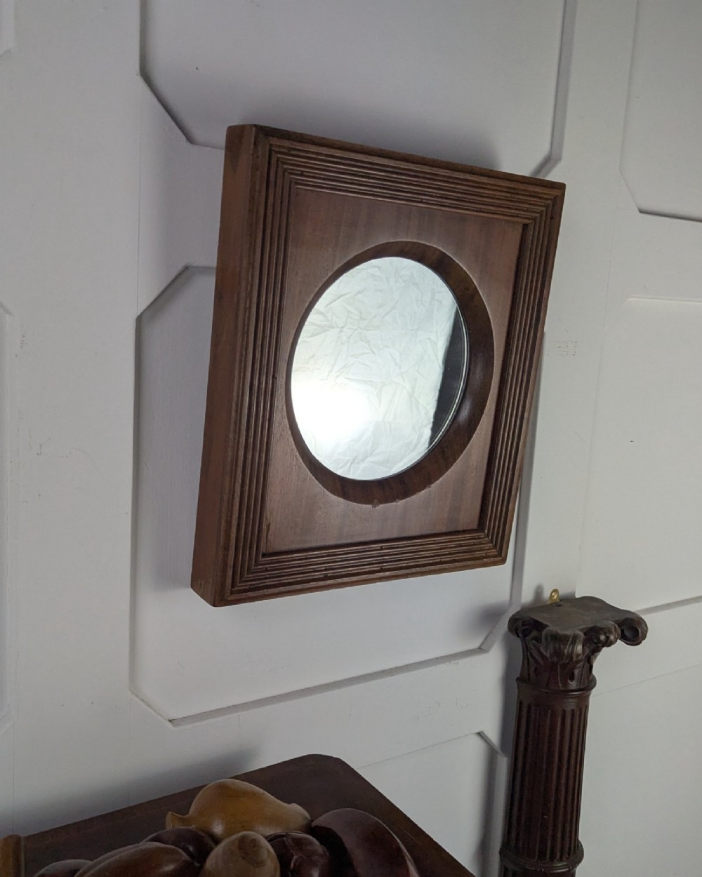 A square dark mahogany frame featuring stepped outer mouldings and a central circular mirror reflection. View II