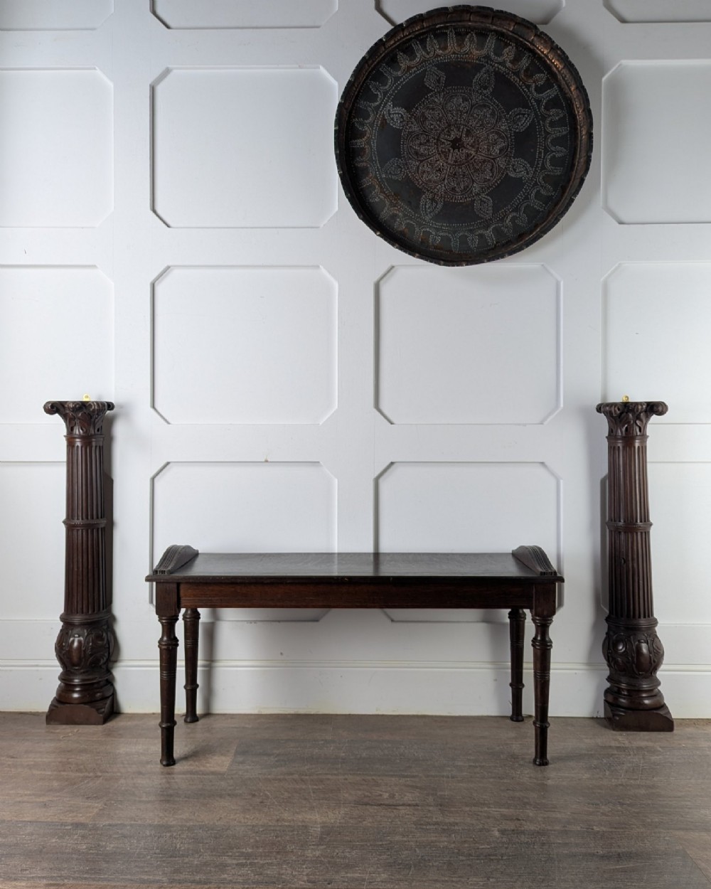 A pair of dark carved mahogany half columns featuring Corinthian capitals, reeded shafts, and carved bulbous bases. View XI