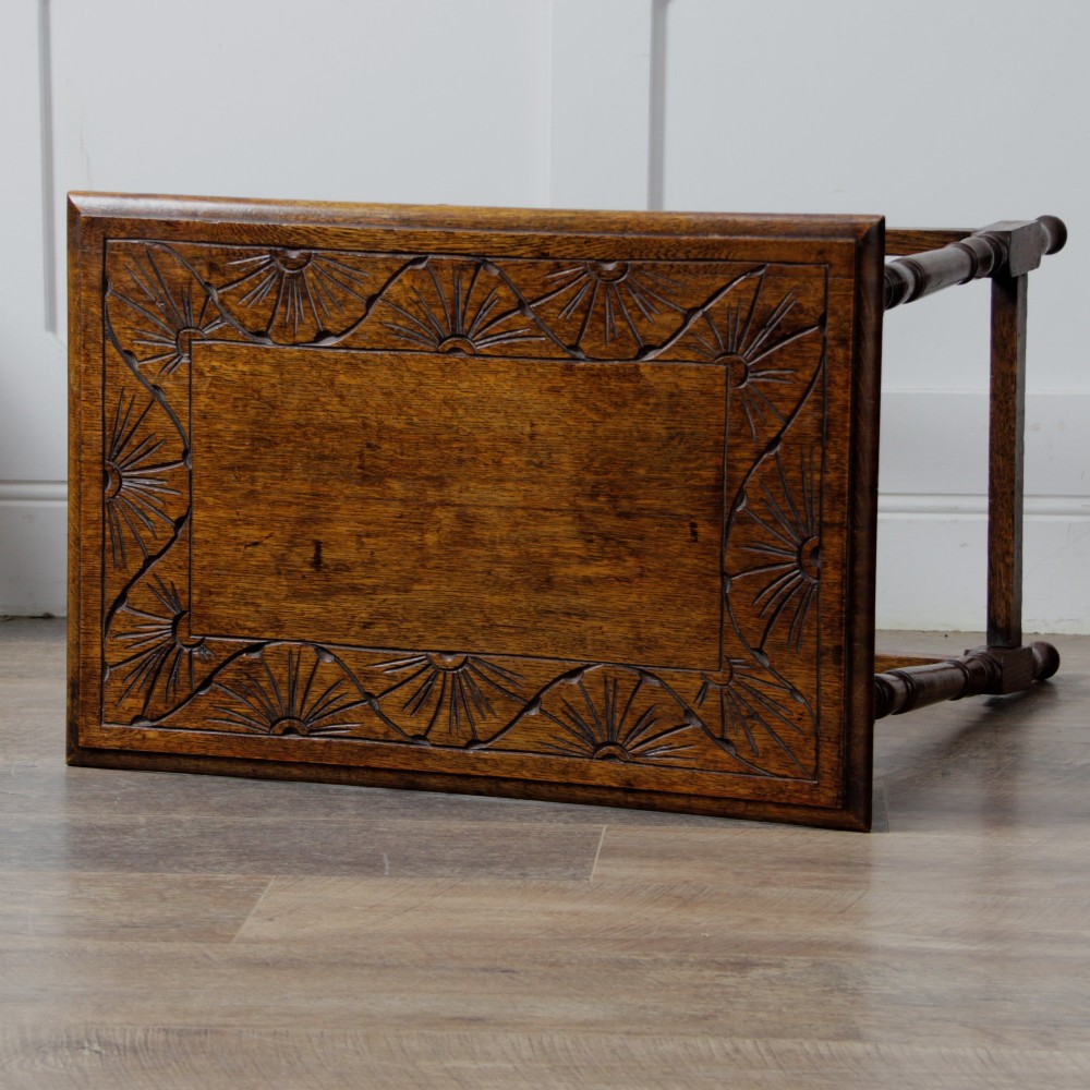 A late Victorian solid oak side table featuring carved apron arches, turned legs, and a rectangular top supported by low box stretchers. View XI