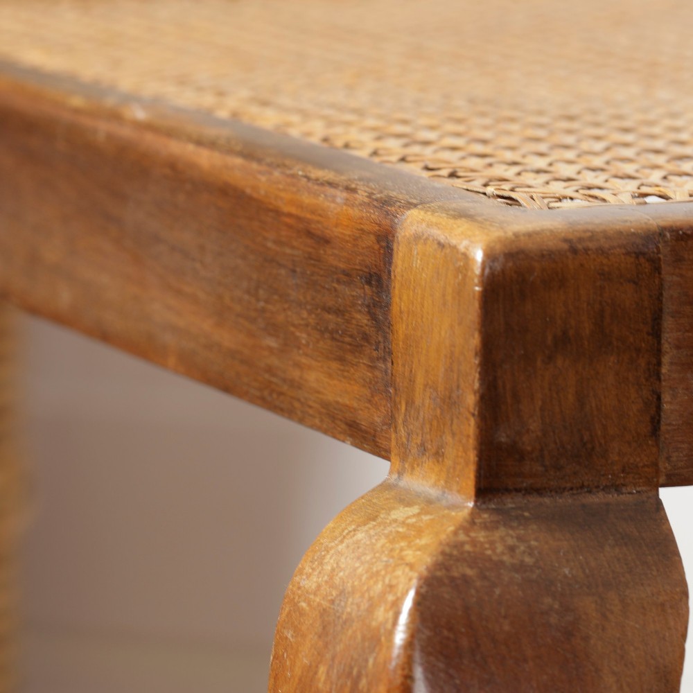 A low walnut luggage stand featuring a rectangular woven rattan top supported by four cabriole legs with pad feet. View VIII