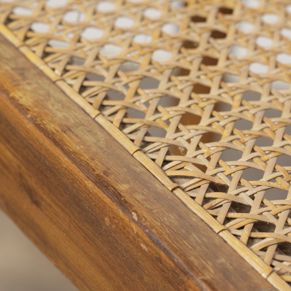 A low walnut luggage stand featuring a rectangular woven rattan top supported by four cabriole legs with pad feet. View IX