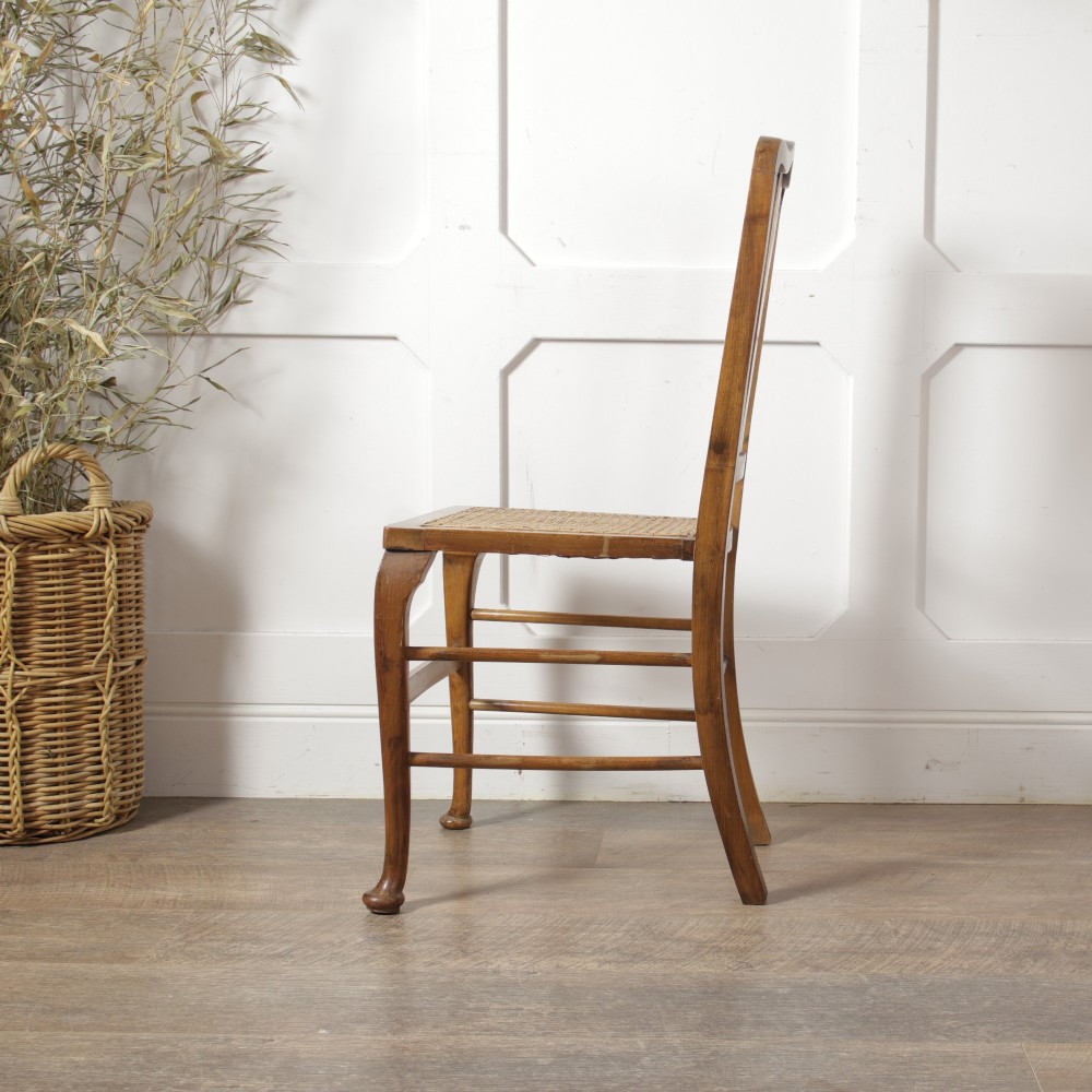 A low walnut luggage stand featuring a rectangular woven rattan top supported by four cabriole legs with pad feet. View XII
