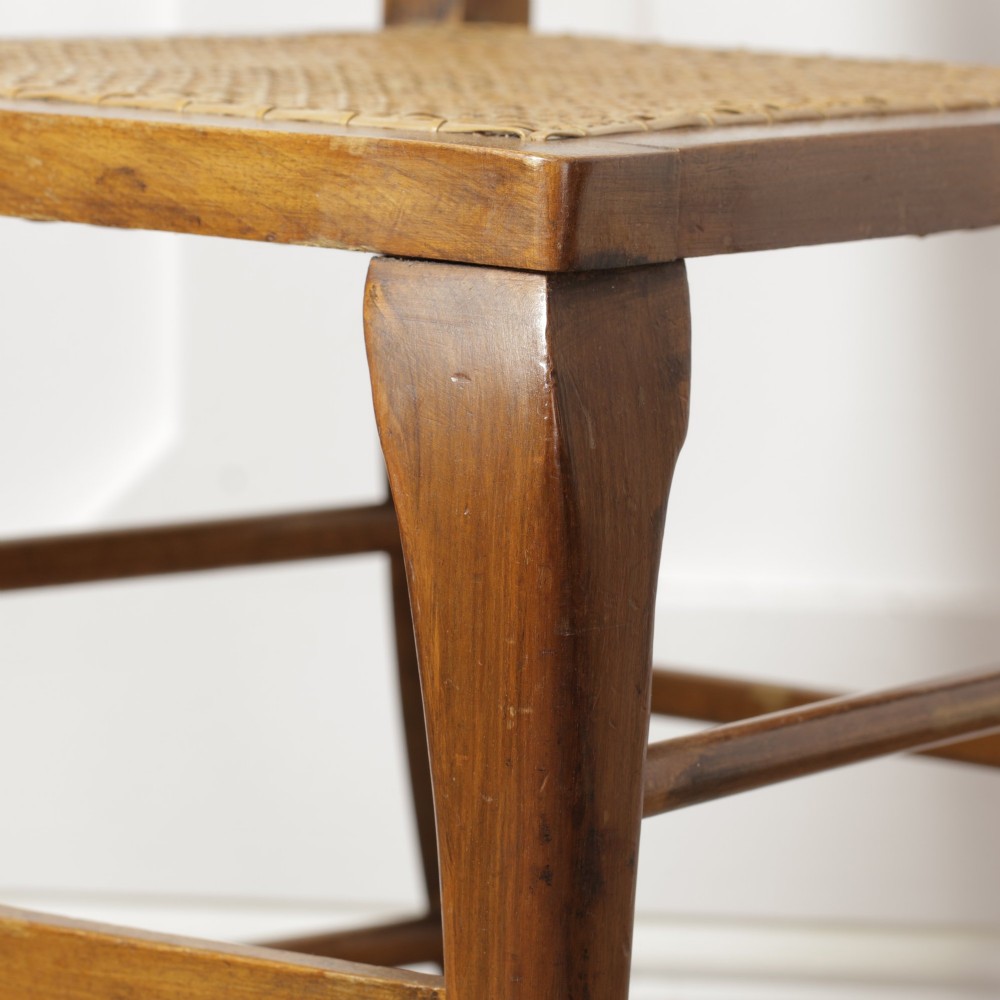 A low walnut luggage stand featuring a rectangular woven rattan top supported by four cabriole legs with pad feet. View XIV