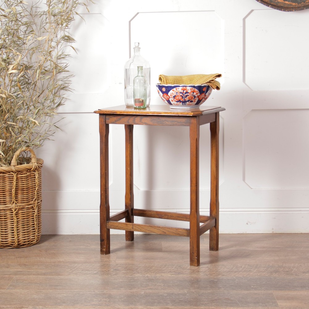 A rectangular warm brown oak side table featuring chamfered legs, bevelled top edges, and lower support stretchers. View II