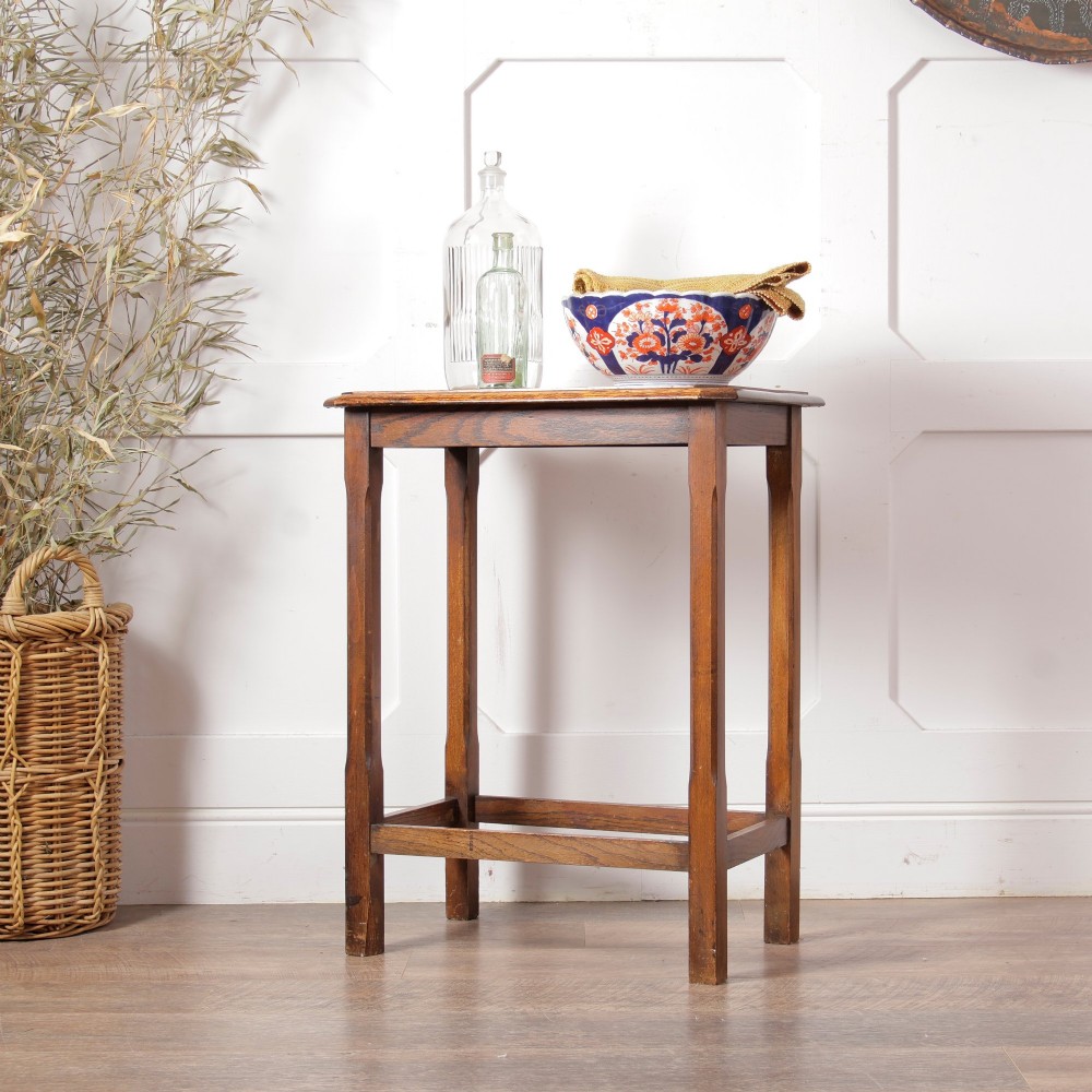 A rectangular warm brown oak side table featuring chamfered legs, bevelled top edges, and lower support stretchers. View III