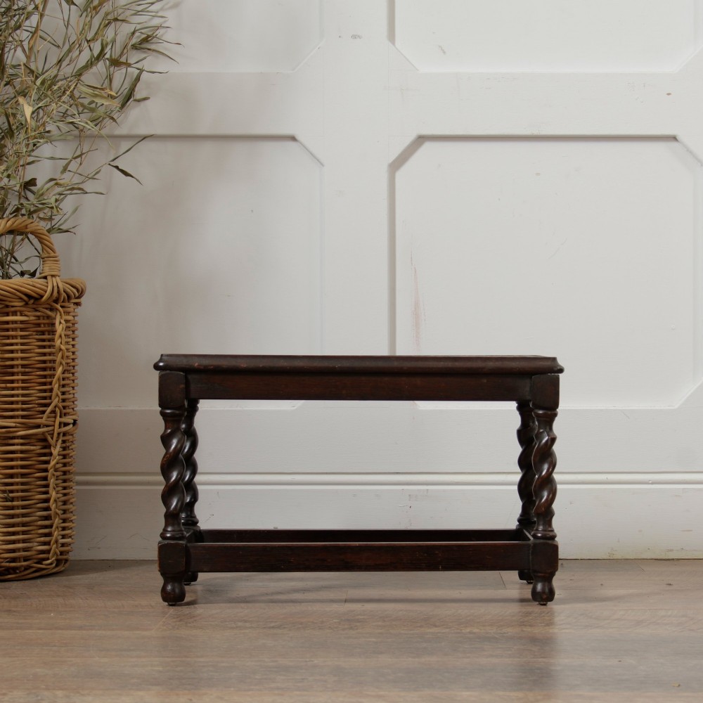 A low dark oak rectangular stool featuring four spiral barley twist legs connected by lower stretchers. View VIII