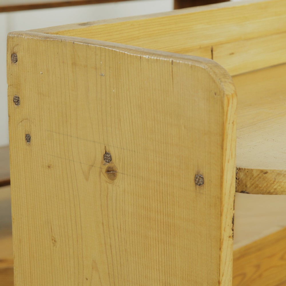 A low three-tier vintage pine open-backed bookshelf with natural timber grain and knots visible throughout. View V