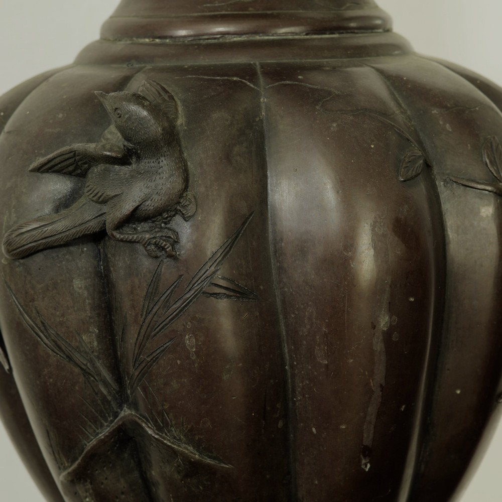 A dark brown patinated bronze vase featuring relief-carved bird motifs, flared neck, and twin dragon handles. View VI