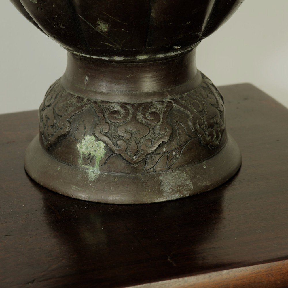 A dark brown patinated bronze vase featuring relief-carved bird motifs, flared neck, and twin dragon handles. View XI