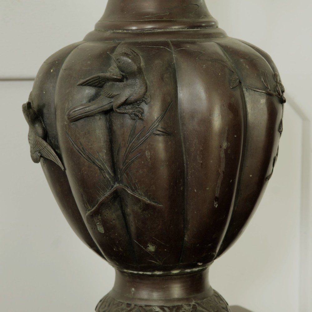 A dark brown patinated bronze vase featuring relief-carved bird motifs, flared neck, and twin dragon handles. View XII