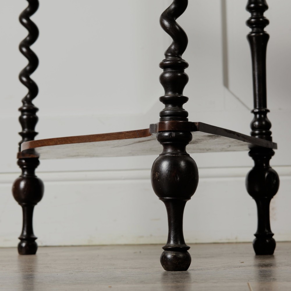 A Victorian mahogany corner whatnot featuring three shaped tiers supported by carved barley twist columns and turned finials. View XI