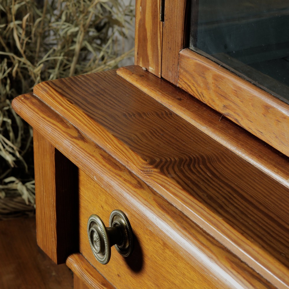 A late Victorian stripped pitch pine glazed cupboard with a three-door glazed upper display section above two drawers and three lower panelled cabinet doors. View VIII