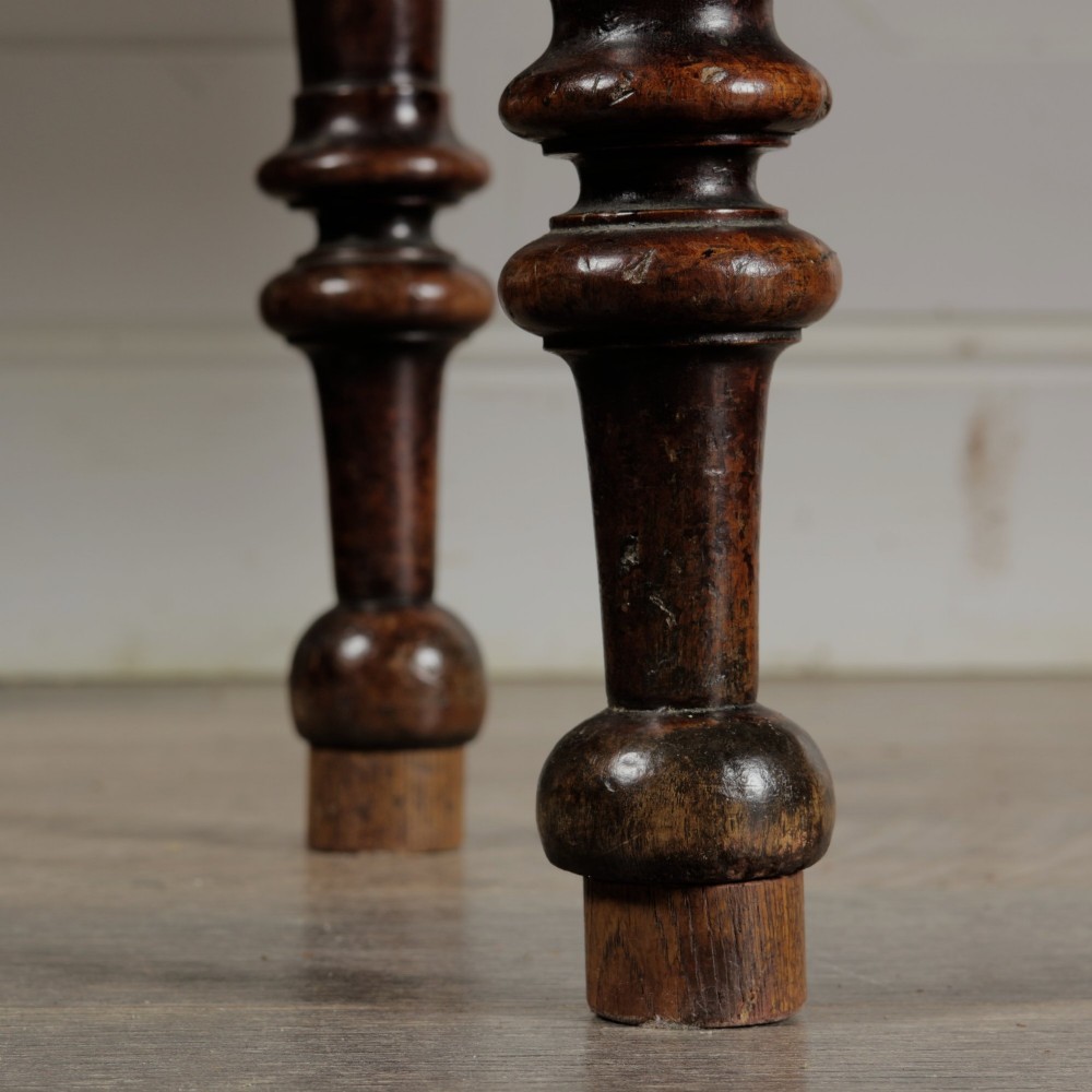 A Victorian mahogany gateleg table with two hinged drop leaves, a rectangular top, and turned wooden legs. View XI