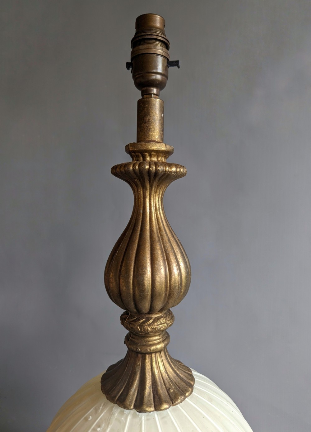 A white ribbed opaline glass table lamp featuring cast brass floral appliques, an ornate footed base, and a fluted metal neck. View VIII