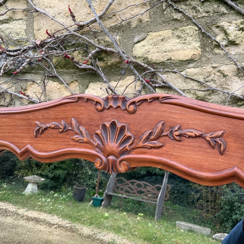 A rectangular French timber wall mirror featuring a carved shell cresting motif and a scalloped inner frame moulding. View II