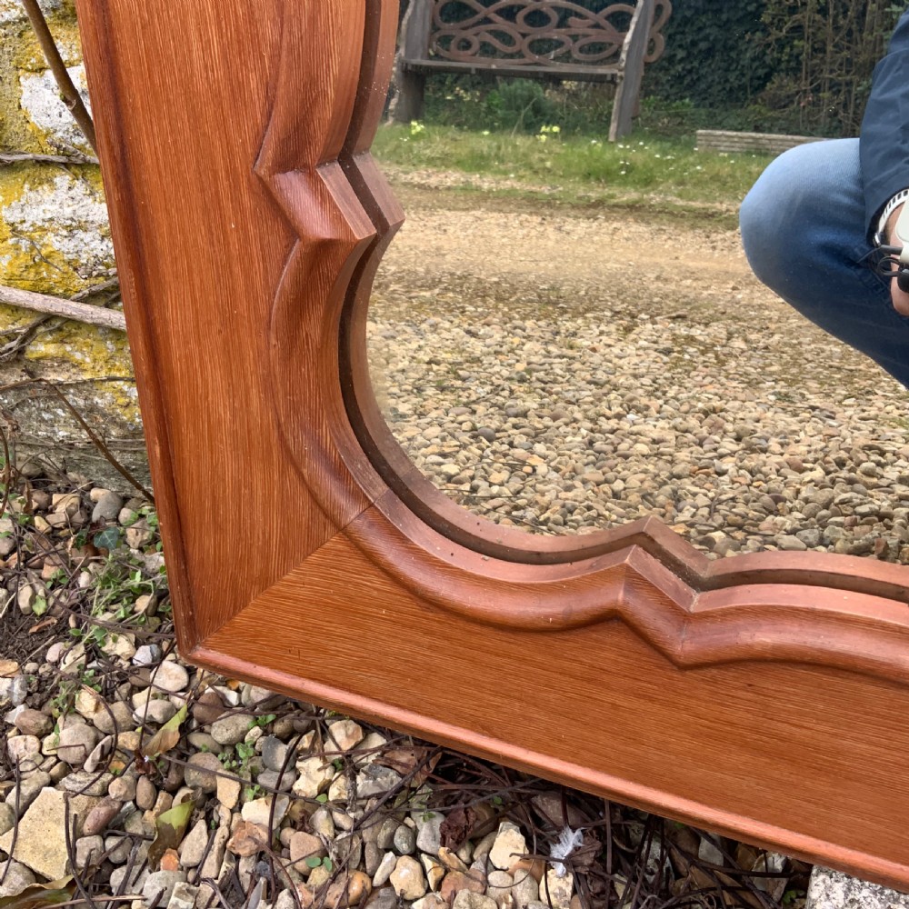 A rectangular French timber wall mirror featuring a carved shell cresting motif and a scalloped inner frame moulding. View III