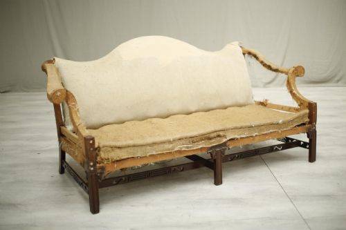 fig 1. American c.1920's camel backed sofa with fret work stretcher