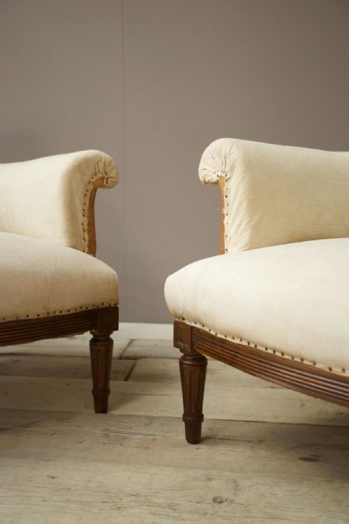fig 1. Pair of square back armchairs with carved frame