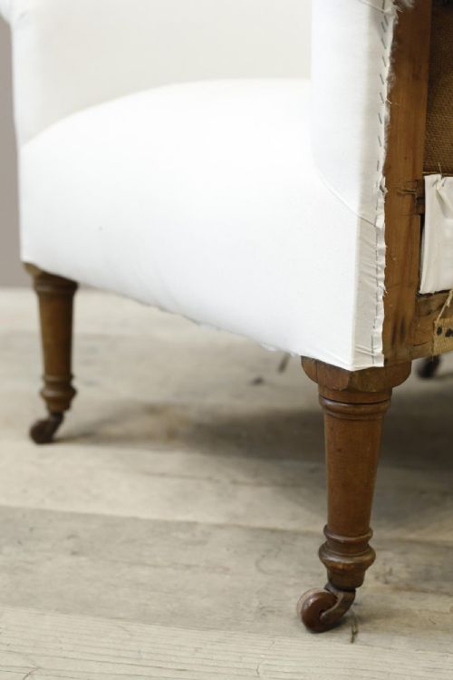 fig 1. Large proportioned Edwardian armchair on tall legs