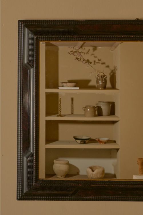 fig 1. A large rectangular 19th-century Italian wall mirror featuring a dark ebonised timber frame with geometric mouldings and a thin gilt inner border.