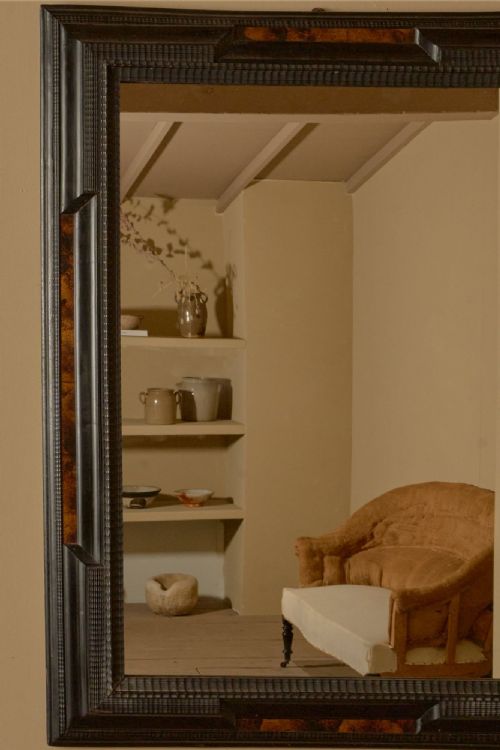fig 1. A large rectangular 19th-century Italian wall mirror framed in dark ebonised wood with inset faux tortoiseshell panels.
