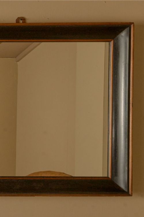 fig 1. An early nineteenth-century rectangular Italian wall mirror featuring a two-tone ebonised and natural wood box frame with a top hanging loop.