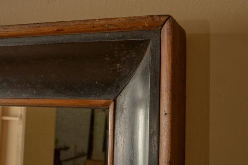 fig 2. An early nineteenth-century rectangular Italian wall mirror featuring a two-tone ebonised and natural wood box frame with a top hanging loop.