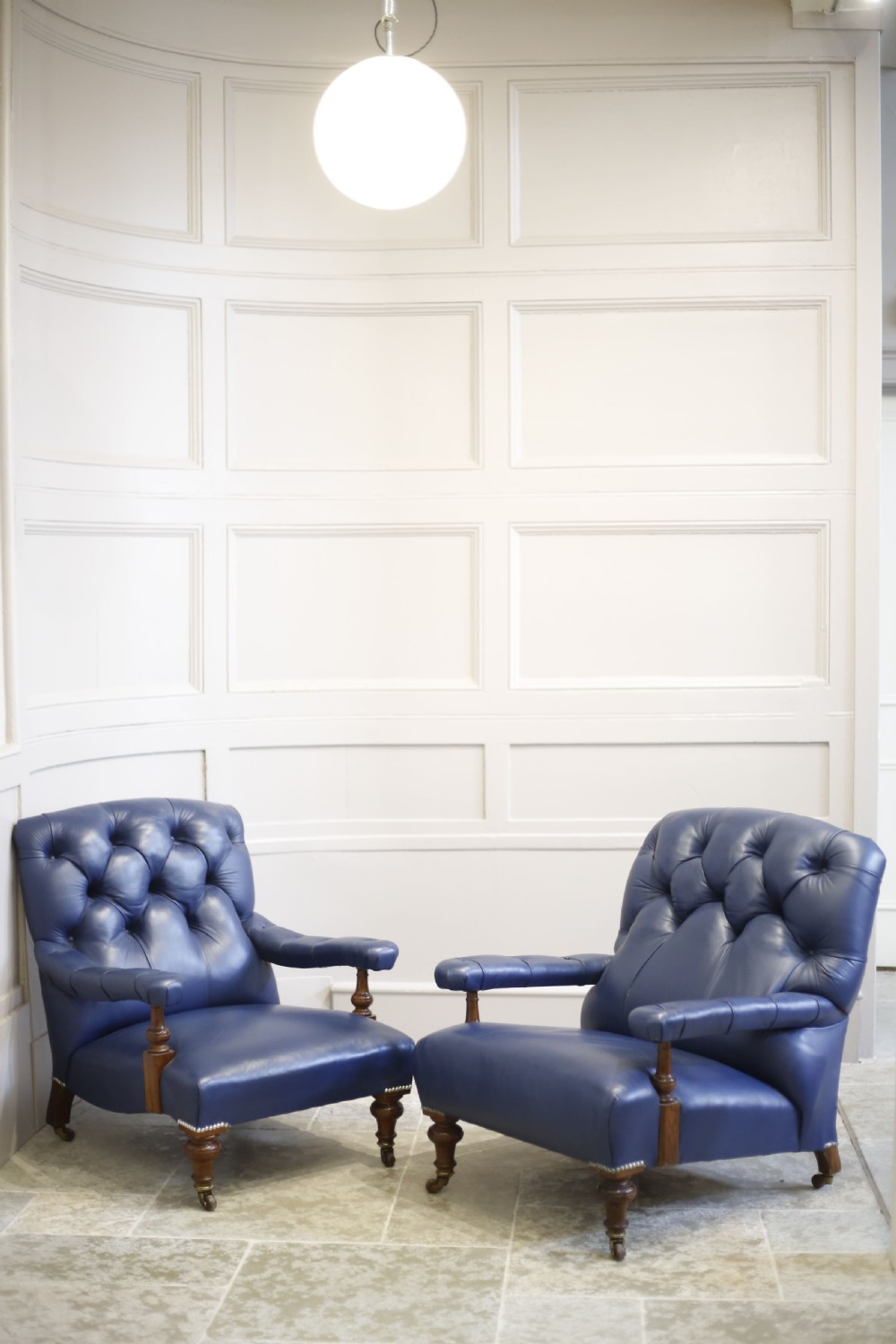 Pair of Victorian his and hers Leather open armed armchairs