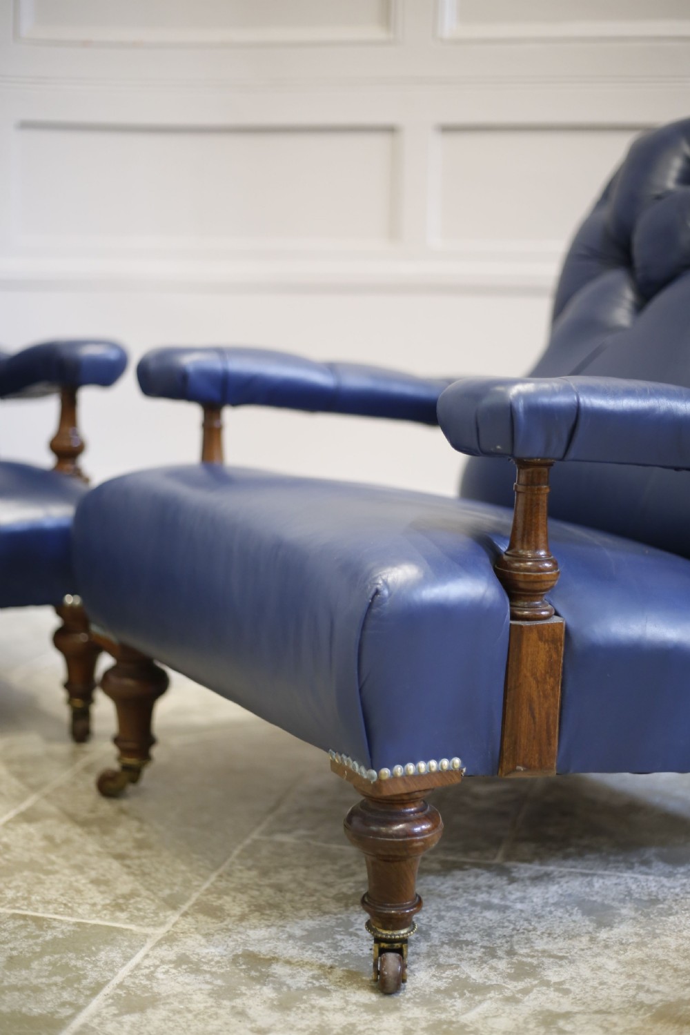 Pair of Victorian his and hers Leather open armed armchairs View III