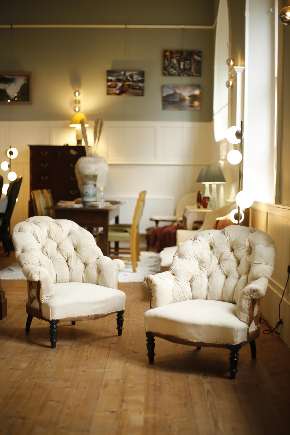 Pair of Napoleon III curved buttoned armchairs